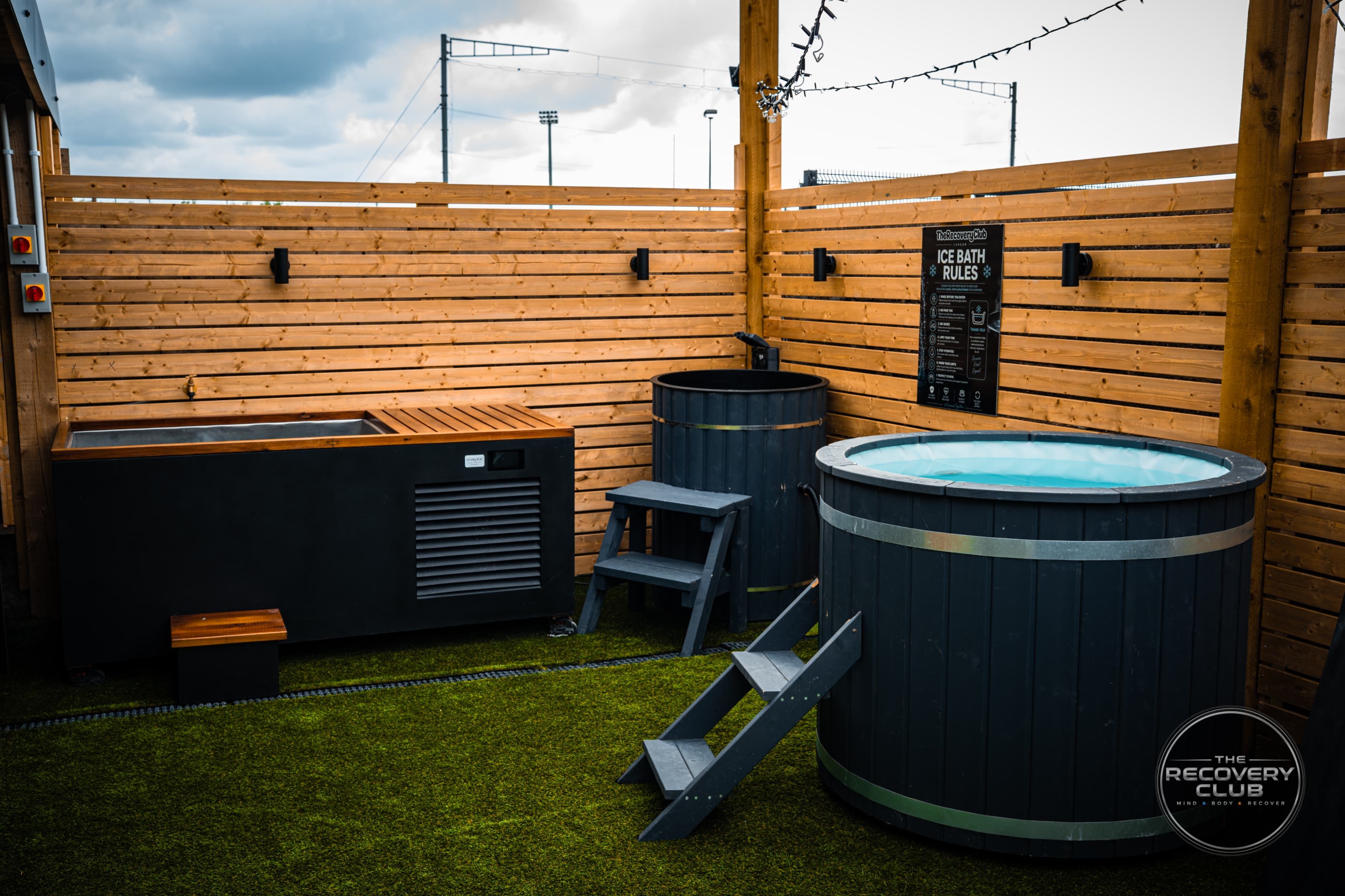 The club’s ice baths and cold plunge beside the timber deck.